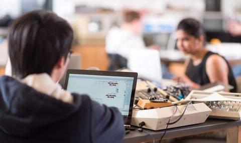 students working in computer science class